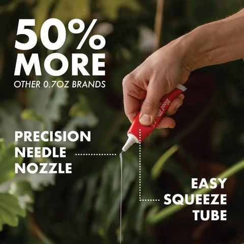 Hand holding Boot Mender Glue For Shoes Clear Instant Bond Heavy Duty Adhesive For Soles And Heels 30g Tube, precision nozzle visible