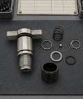 Premium Impact Driver Socket Anvil Kit For DCF885 Repair Set With Steel Construction And Textured Grip Sleeve Perfect Tool Accessory For Heavy Duty Service And Maintenance Jobs That Are Total Game Changers. Steel repair kit parts laid out on a mat.