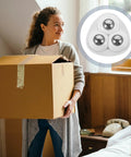 Adhesive Ball Caster Wheels For Furniture Flat Mount ABS Material 20 Lbs Load Per Wheel shown next to a woman carrying a box.