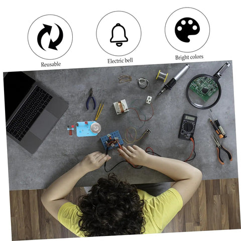 Student using Two Piece Physics Experiment Electric Bell Electromagnet Teaching Instrument with tools and laptop on desk.
