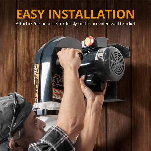 Person installing Heavy Duty 1 HP Wall Mount Dust Collector Delivers 560 CFM With 1 Micron Bag on wooden wall