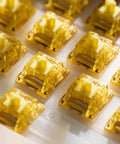 Close-up of Creamy Yellow V5 Linear Keyboard Switches with LED diffuser, 5Pin 50gf lubed for mechanical gaming keyboards, 45pcs.