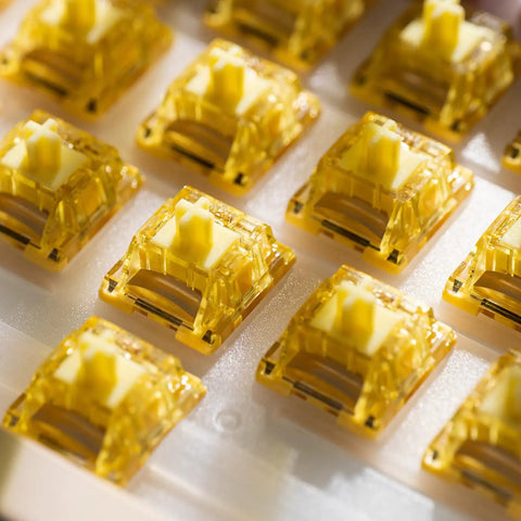 Close-up of Creamy Yellow V5 Linear Keyboard Switches with LED diffuser, 5Pin 50gf lubed for mechanical gaming keyboards, 45pcs.
