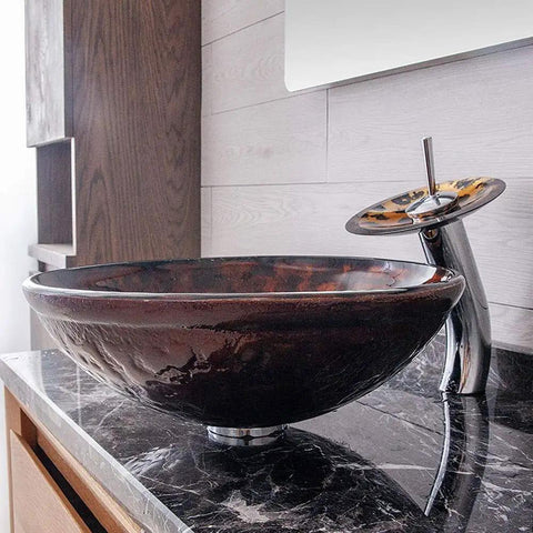 USZWBY Artistic Vessel Sink Bathroom Tempered Glass Vanity Sink, Round Bowl and Waterfall Faucet Chrome on marble countertop.