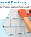 Blue plastic tile spacers on white ceramic wall tiles during installation (front view)