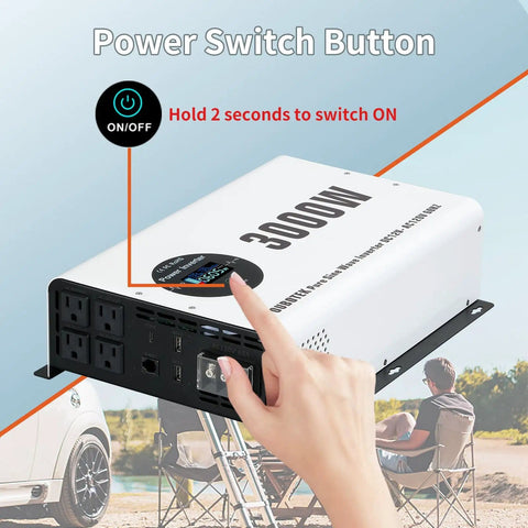 Hand pressing power button on Beefy 3000W Pure Sine Wave Inverter 12V DC To 120V AC Car Converter with LCD display in outdoor setting