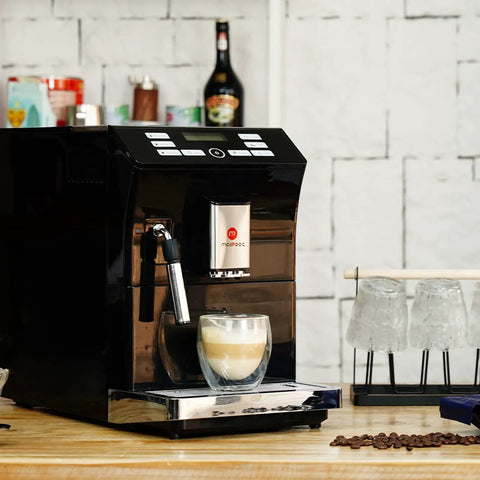 Totally Automatic Espresso Coffee Maker Featuring Responsive Touchscreen Interface with coffee cup, sleek black finish on kitchen counter.