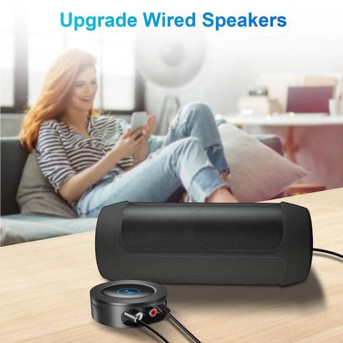 Bluetooth 5.2 Receiver for Home Stereo With RCA and Three Point Five Millimeter AUX Output Wireless Audio Adapter on table
