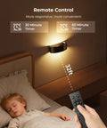 Motion Sensor Wall Light With 5000Mah Battery And Remote Featuring 15 Rgb And Three Warm Modes Dimmable Wireless Sconces in bedroom setting.