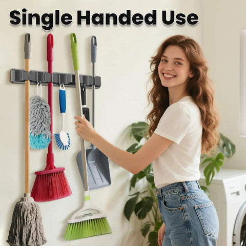 Broom Holder Wall Mount With Four Racks And Three Hooks Adjustable Mop And Broom Organizer in use in a home setting.
