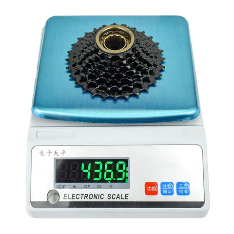 Ride Ready Bike Freewheel For 7 8 9 Speed Shifters 13 28T Or 13 32T Threaded Type on electronic scale showing weight 436.9g