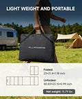 Person carrying folded Beefy Capacity Portable Power Station S2000 Pro 1520Wh LiFePO4 Solar Generator in camping setup.