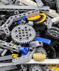 Close-up view of All In One 500 Plus Technic Parts Kit with bricks, bushings, pins, and gears for EV3 projects.