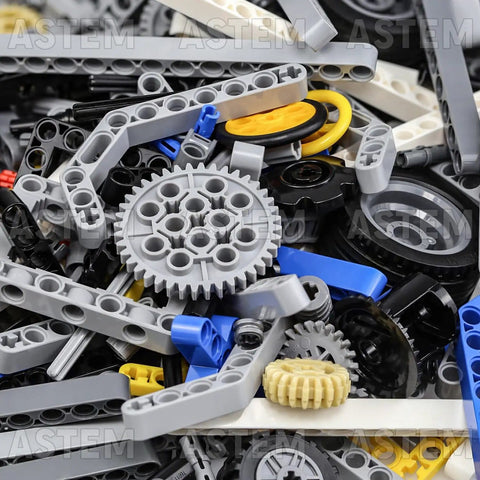 Close-up view of All In One 500 Plus Technic Parts Kit with bricks, bushings, pins, and gears for EV3 projects.