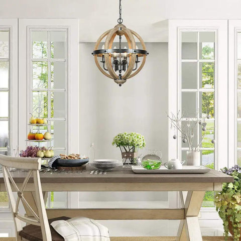 Orb Four Light Farmhouse Chandelier in Stardust Brown finish with rustic wood accents above a dining table.