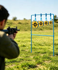 Shooter aiming at Beefy 3/8 Inch Auto Reset Spinner Target For Centerfire Handguns Up To.44 Magnum Outdoor Steel Target in field