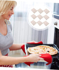 Woman using oven with 10 Pack Mica Insulation Sheets 150x120mm Microwave Mica Plates for heat resistance