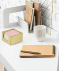 Gold Wood Sticky Note Holder For 3x3 Post It Notes on a desk with notebook and pen, ideal for office and school use.