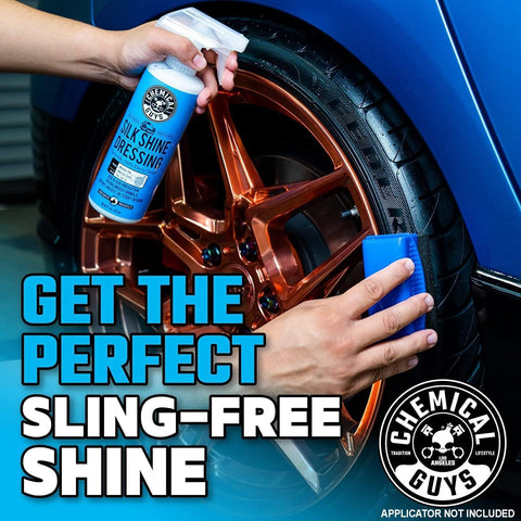 Person applying Silk Shine Dressing to a car's copper-colored rim with blue applicator, achieving a sling-free shine.
