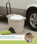 Taupe 15.5 Gallon Resin Garden Cart On Wheels Lightweight two wheel wheelbarrow used for laundry beside a vehicle in a driveway.