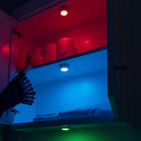 Color Changing LED Puck Lights Battery Operated With IR Remote 40 Lumens Under Cabinet Lighting illuminating shelves