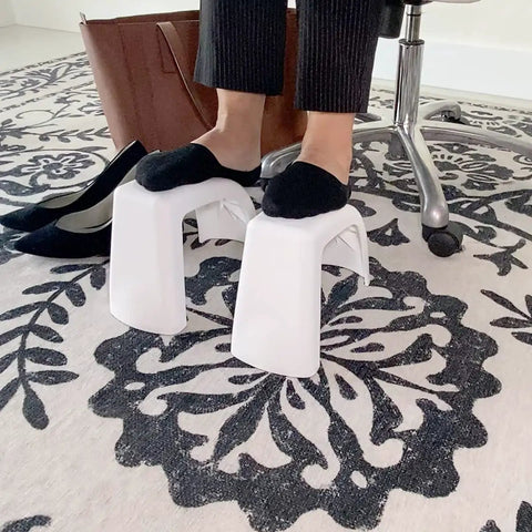 Person using Ultra Lightweight Grab And Go Multi Purpose Foot Stool For Toilet Use, Desk Foot Rest, Pedicure, Leg Shaving And Lace Up Shoes, Stackable White Travel Must Have Made In USA at desk
