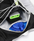 Interior pocket of Lightweight Hydration Pack For Running And Cycling, Adjustable Reflective Vest For Men And Women, showing zippered compartment.