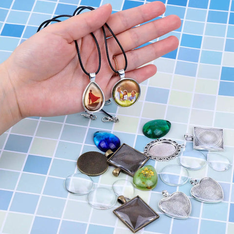 Pendant Tray Jewelry Making Kit With Glass Cabochons 90 Pcs Set Including 30 Bezel Pendants 30 Cabochons And 30 Necklace Cords For DIY Necklaces And Crafting displayed.