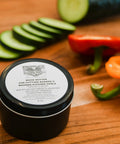 Wood Cutting Board Wax 8 Oz Food Grade Mineral Oil And Beeswax Conditioner For Butcher Block And Wooden Kitchen Tools Chef Approved Made In USA Supports Animal Rescue next to sliced vegetables on a wooden board.