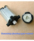 Close-up of Planetary Gear Electronic Starter Motor, 420 RPM, 12mm Shaft, 5V/6V Compatible with exposed gear components on a surface