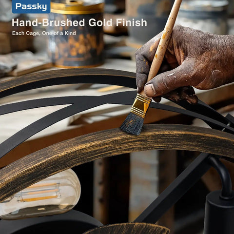 Artisan painting an industrial black cage fandelier for a 20 Inch Farmhouse Flush Mount Ceiling Fan with Lights and Remote.