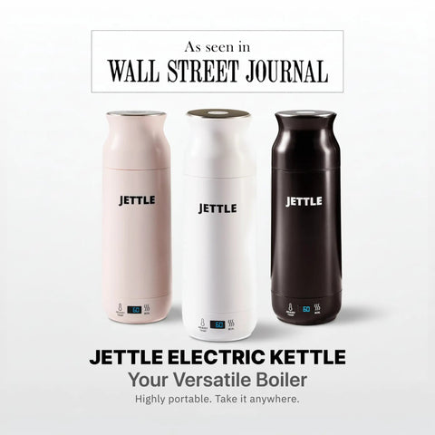 Three Jettle electric kettles in pink, white, and black colors with LED displays, as seen in Wall Street Journal, portable design.