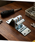 Heavy Duty Garage Door Hinges With Thickened Metal Construction And Double Bearing Pivot Industrial Gate Corner Hinge In Silver For Warehouse And Factory Use Low Maintenance And Durable Door Hardware, silver hinge on wood table
