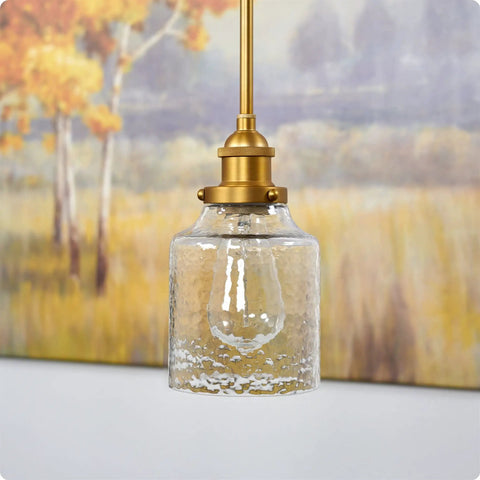 Set Of Three Hammered Cylinder Glass Shade Pendant Lights For Bathroom Vanity And Chandelier Upgrade In Modern Water Glass Design 6 Inch By 5 Inch Shades That Fit Threaded Medium Base Sockets Perfect For Any Home hanging shown in modern setting
