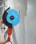 A Heavy Hitter Circular Concrete Saw Powered By A Rugged 3000W Copper Motor cutting through a concrete wall with a diamond blade.