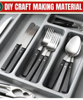 Black-handled cutlery set in a drawer organizer labeled 'DIY Craft Making Material'.