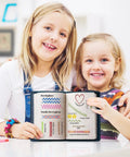 Two children holding DIY Embroidery Stitch Book Kit With 106 Illustrated Stitches, showing colorful patterns in a home setting.