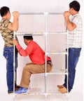 Portable Freestanding Wardrobe Built Tough With Breathable Fabric Delivers Huge Closet Storage For Clothes Shoes And Hats Hassle Free Pop Up Assembly Glides Into Any Room In Fresh Colorful Vibes with three men assembling it.