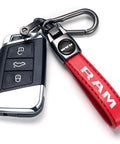 Slick Genuine Leather Car Key Chain Ring Compatible With Dodge Ram 1500 2500 3500 Featuring A Hella Sturdy Zinc Alloy Charm and a stylish red key strap.