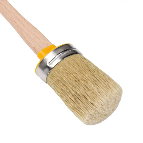Close-up of a precision round brush with a metal ferrule and wooden handle from the Sweet Kick Ass DIY Painting Set.
