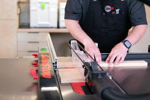 Advanced T Glide Rip Fence Rock Solid Design With Dovetail Slots Compatible With Industrial Cabinet Saw in use cutting wood.