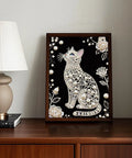 Framed Cat Themed Pearl Diamond Painting Kit For Adults And Beginners, Sparkling Crystal Gem Wall Art on a wooden table.