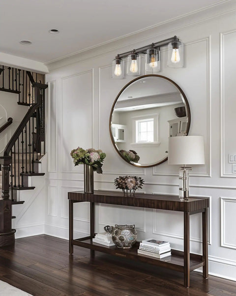 4 Light Vanity Light Fixture in Oil Rubbed Bronze Finish with Clear Glass Cylinders above entryway console table.