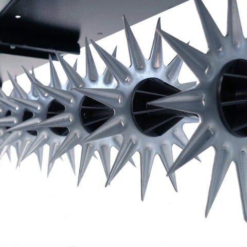 Close-up of 11 tine stars with 12 spike tips on a Tow Behind Spike Aerator With Transport Wheels, galvanized carbon steel.