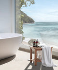 21 Inch Poly Lumber Waterproof Shower Bench With Storage Shelf near bathtub by beach view window