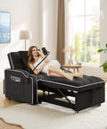 Three In One Velvet Sleeper Chair Bed With Phone Holder And USB Ports in recliner mode, black, woman using phone holder