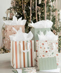 Grab And Go Medium Sized Gift Bag Set With Handles, 9 Inch, Includes Matching Tissue Paper, Cards, Stickers, And Envelopes, Reusable Gift Wrapping Kit For Birthdays, Weddings, Mother's Day Or Any Occasion displayed in front of a decorated tree.