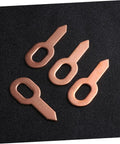 Pro Grade 50 Pack Aluminum Welding Sheet Metal Tabs For Quick Beat Up Panel Fixes And Hot Rod Garage Builds No Mess Gripper Clamps With Soft Touch Handles And Vintage Gold Paint Job shown in copper finish, displaying four tabs on black background.