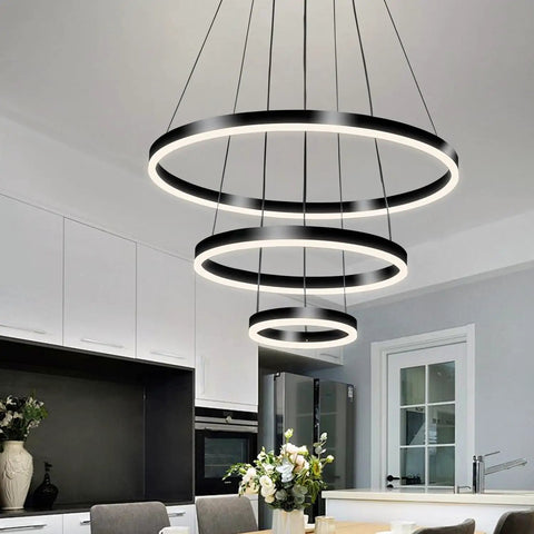 Slick Black Circular LED Pendant Light With Adjustable Height in modern kitchen setting, 4000K neutral white, triple ring design