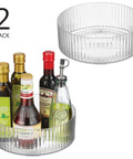 Two Pack Fluted Lazy Susan Plastic Spinner Turntable For Kitchen Counter Organizing Rotating Organizer Swivel Tray For Spices And Accessories 9 Inch Round Clear Sturdy Build, holding bottles.